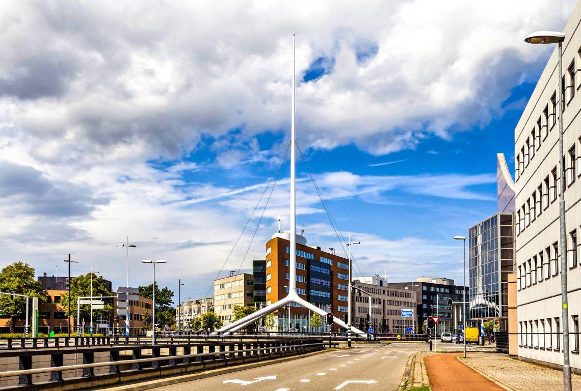 Thin white steeple on one of the crossroads of Eindhoven