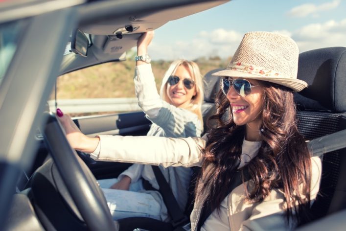 Smiling-women-enjoying-in-cabriolet-car