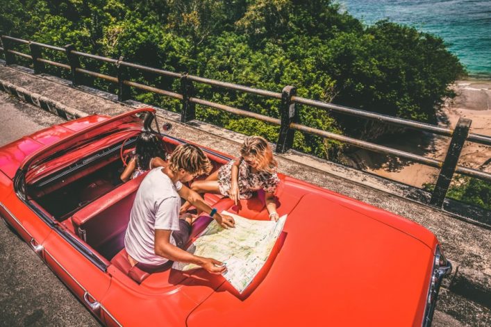 Happy young people in convertible car
