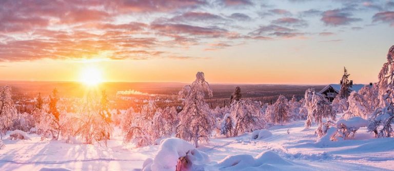 Panoramic-view-of-beautiful-winter-wonderland-scenery-in-scenic-golden-evening-light-at-sunset-with-clouds-in-Scandinavia-northern-Europe_1022646601